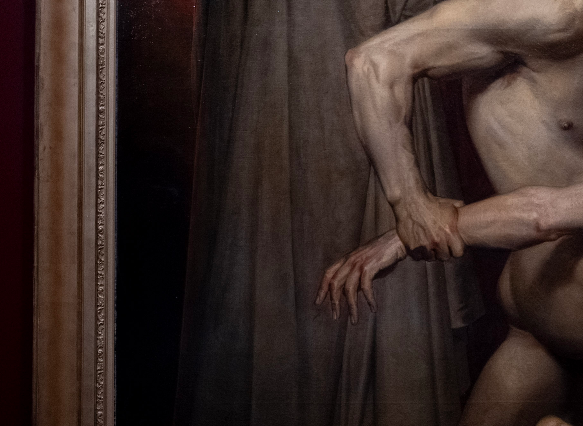 Detail of a painting: outstretched arms and hands against dark drapery